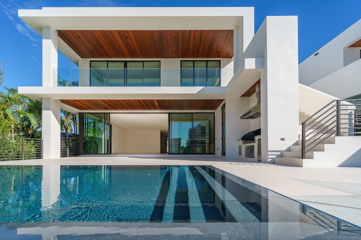Modern luxury home with glass facade at dusk
